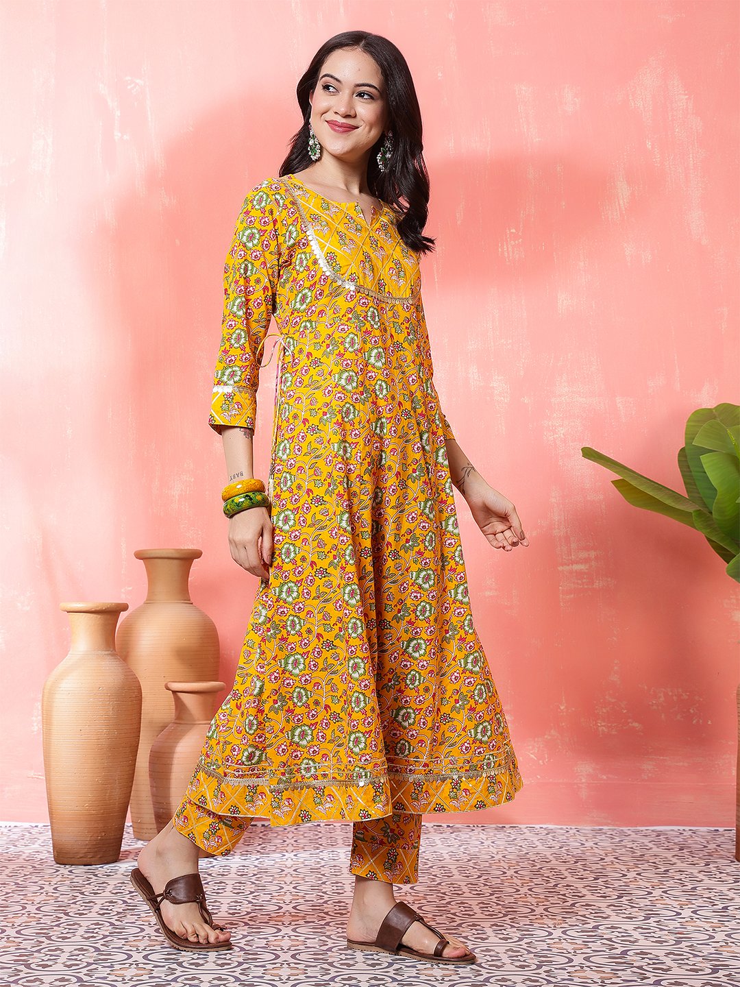 woman in yellow printed anarkali kurta set with dupatta