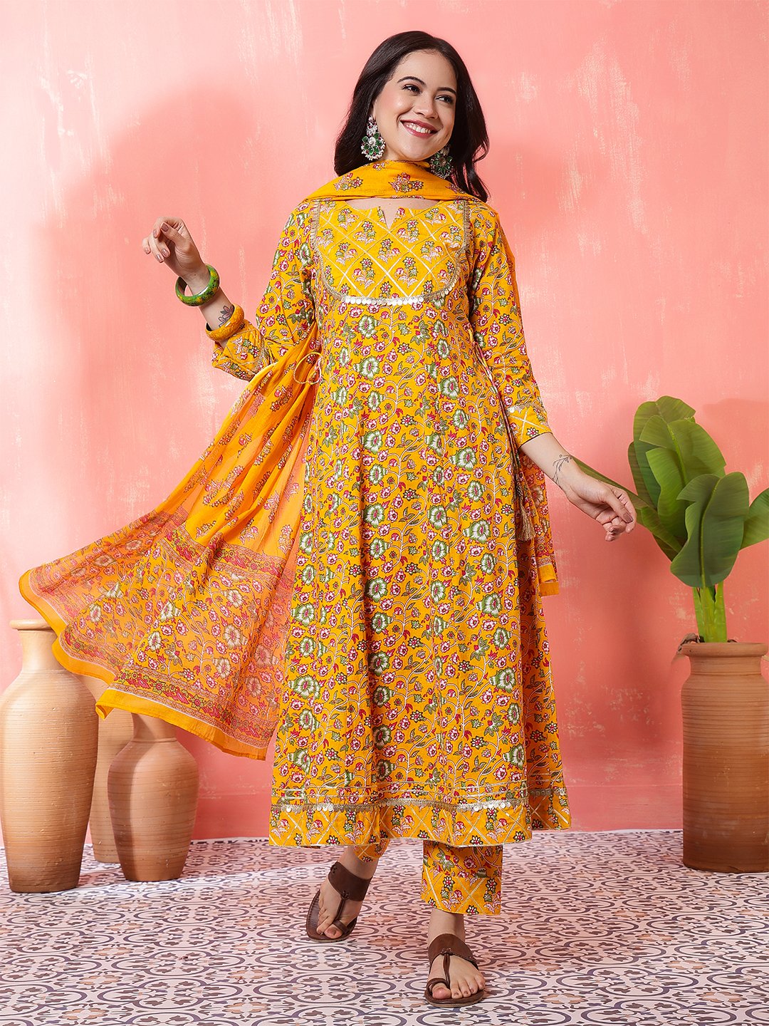 woman in yellow printed anarkali kurta set with dupatta