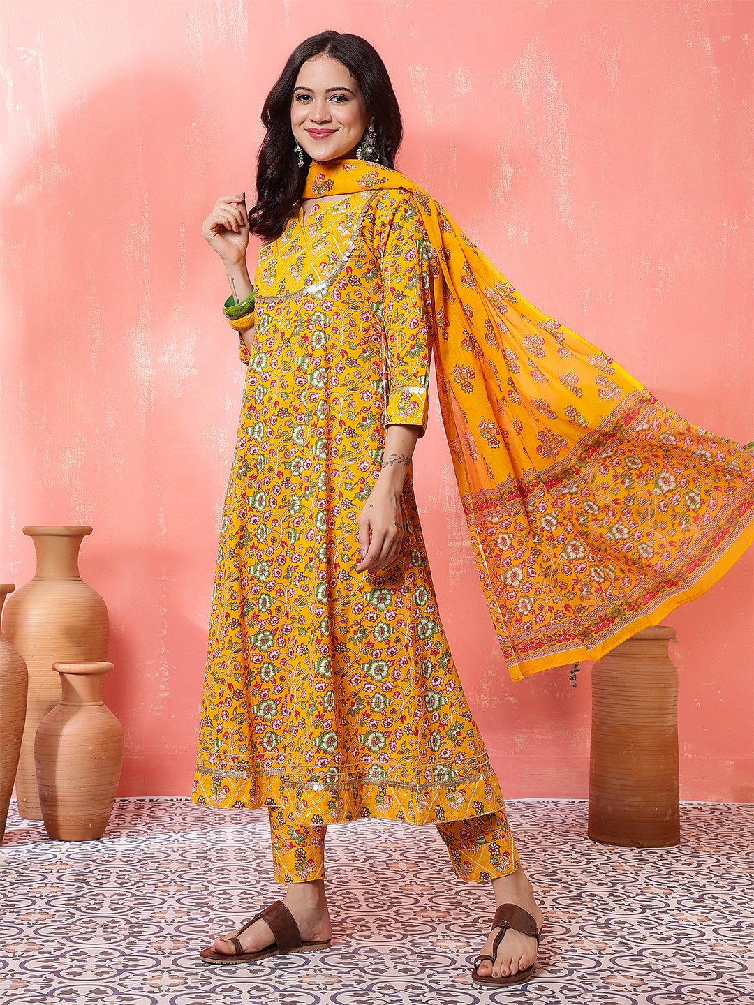woman in yellow printed anarkali kurta set with dupatta