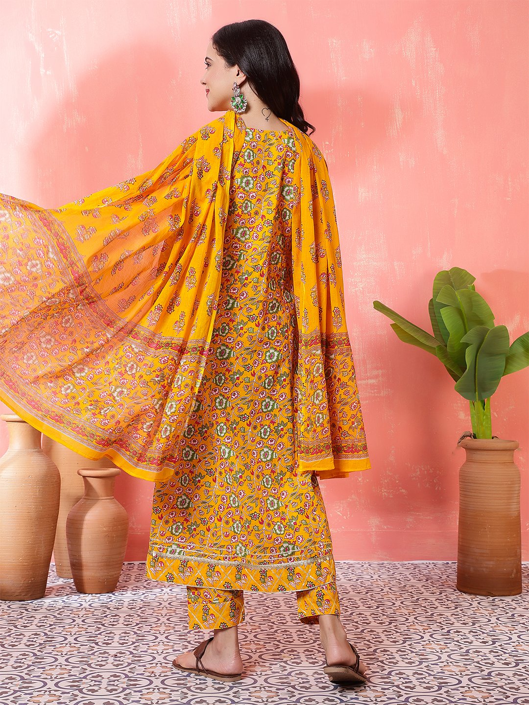 woman in yellow printed anarkali kurta set with dupatta