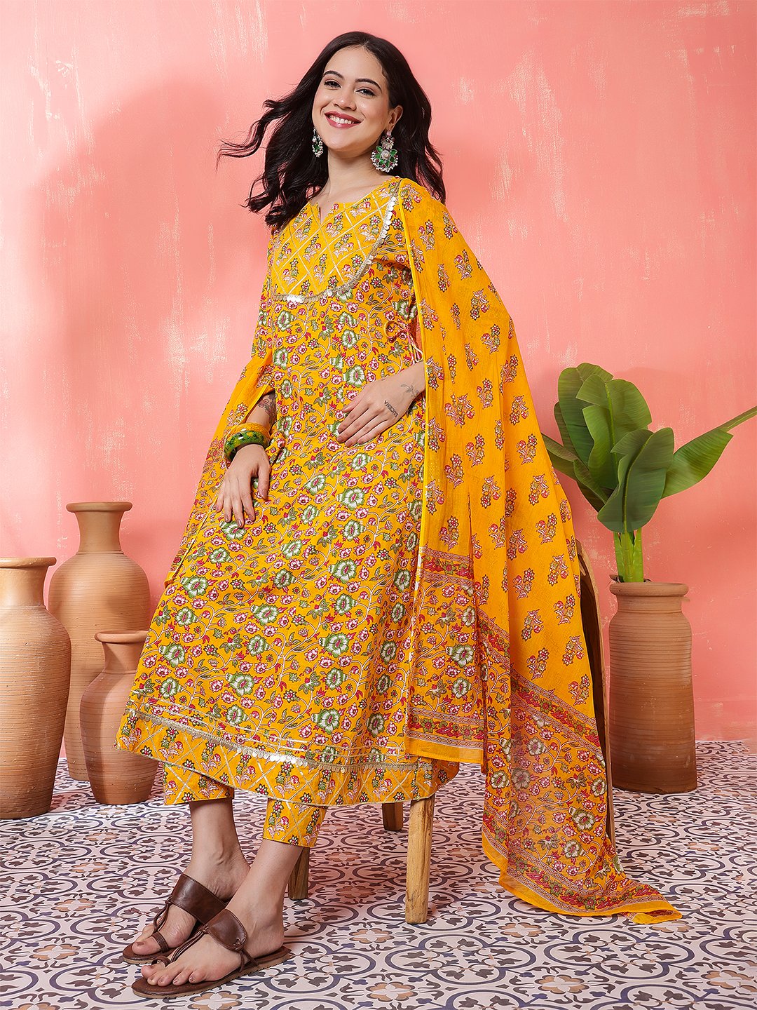 woman in yellow printed anarkali kurta set with dupatta